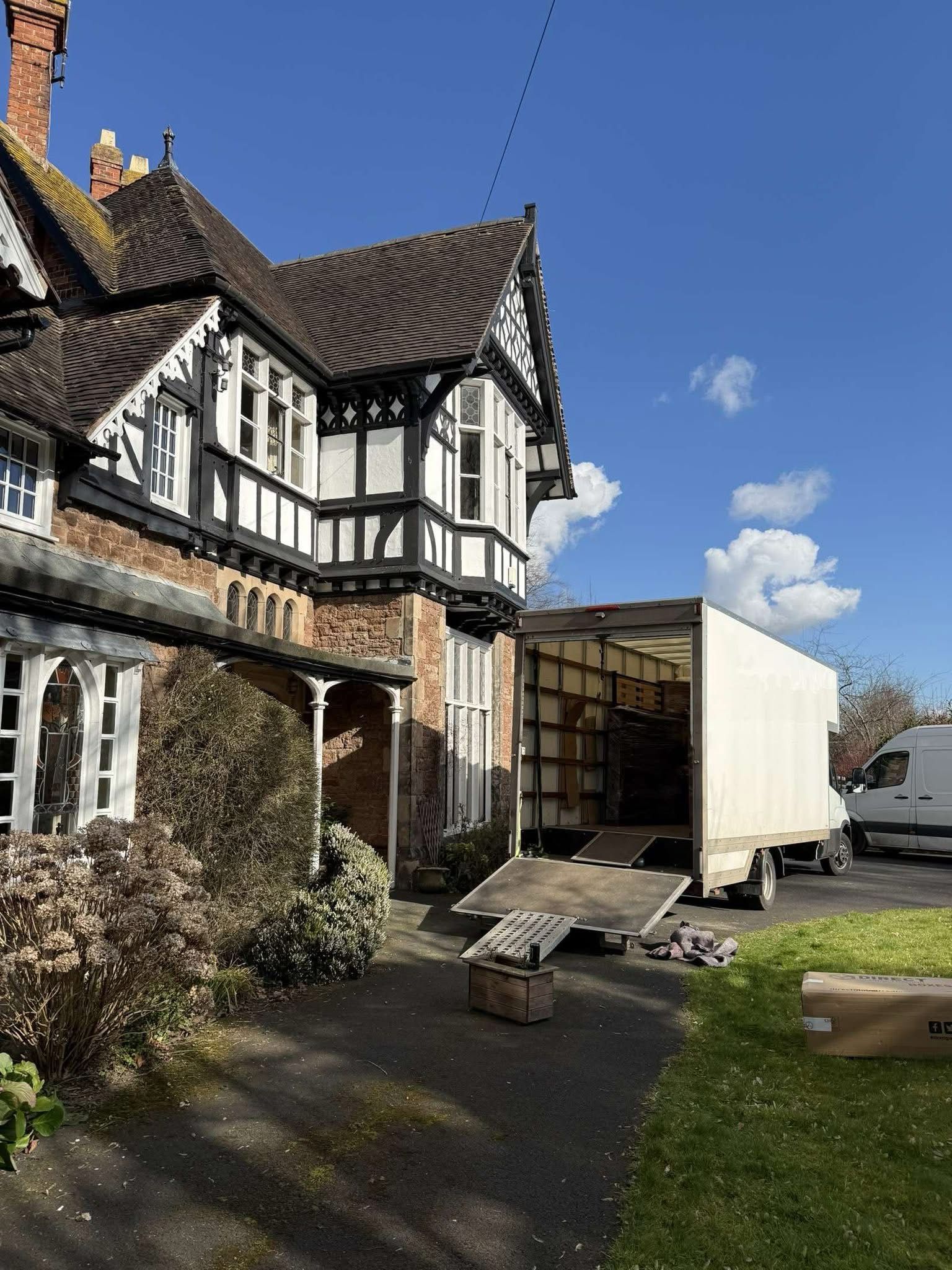 Removal van being loaded with household items